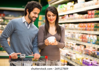 Young couple choosing food in a supermarket