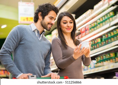 Young couple choosing food in a supermarket