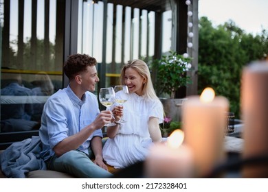 Young Couple Clinking With Wine Outdoors, Weekend Away In Tiny House In Countryside, Sustainable Living.