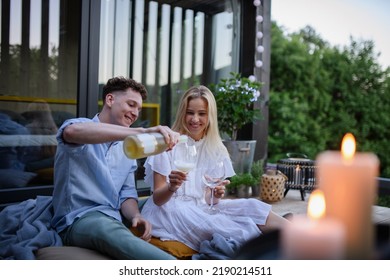 Young Couple Clinking With Wine Outdoors, Weekend Away In Tiny House In Countryside, Sustainable Living.
