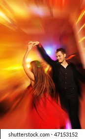  Young Couple Dancing In The Night Club