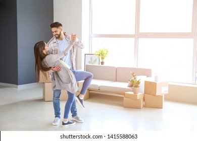 Young Couple Dancing In Their New House