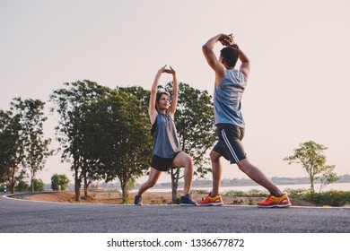 Young Couple Doing Exercises And Warm Up Before Run And Physical Fitness Test
