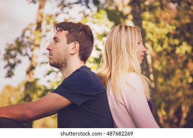 Young couple don't stare at each other and staring in their direction.