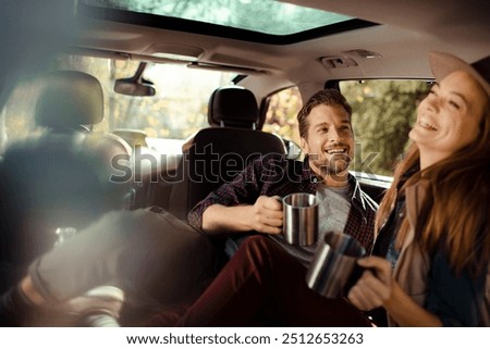 Two young women resting sitting inside of car