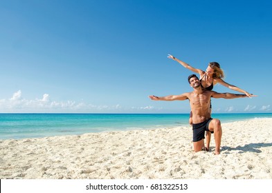 Young couple enjoying the beach