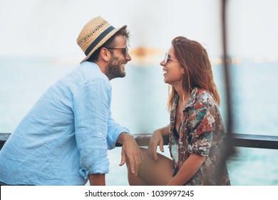 Young couple enjoying at the beach bar - Powered by Shutterstock