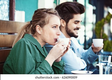 Young couple is enjoying coffee in the morning.