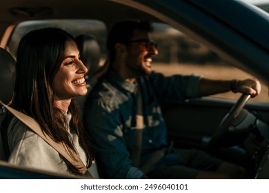 Young couple enjoying the freedom on a Car Trip over a country offroad - Powered by Shutterstock