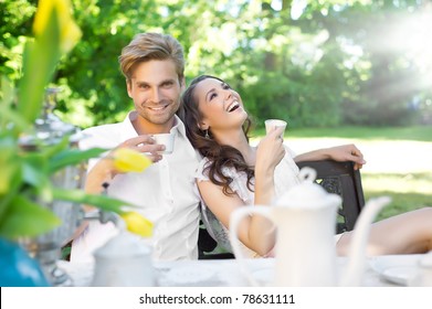 Young couple enjoying lunch in the garden - Powered by Shutterstock