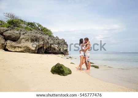 Young couple enjoying on the beach