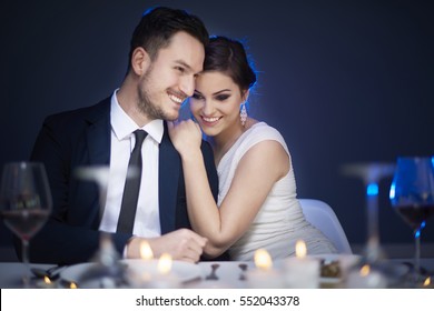 Young Couple Enjoying Romantic Meal Together 