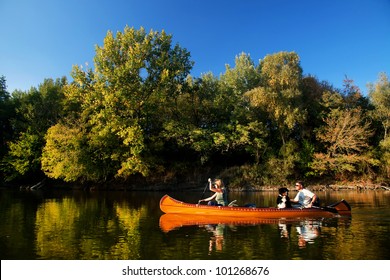 Young Couple Enjoying A Trip In A Canoe