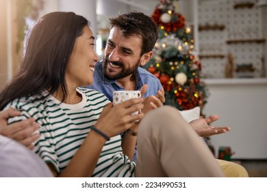 a young couple enjoying the wonderful moments of Christmas morning