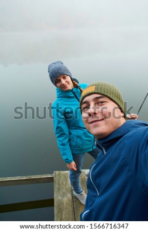 Young couple fishing in the early morning