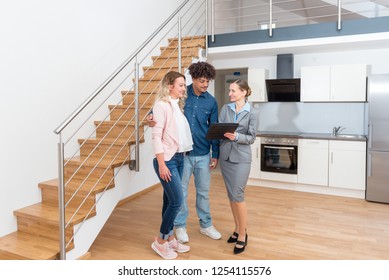 Young Couple Getting Tour Through Apartment They Consider Renting 