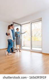 Young couple getting tour through apartment they consider renting or purchasing - Shutterstock ID 1656393919