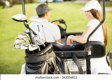 Young Couple At Golf Cart