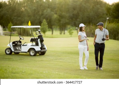 Young Couple At Golf Cart