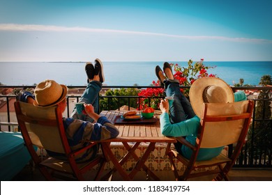 young couple have breakfast on balcony terrace with sea view - Powered by Shutterstock