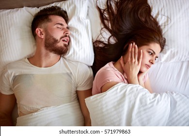 Young couple have problem with man's snoring 