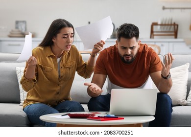 Young Couple Having Argument About Family Budget At Home