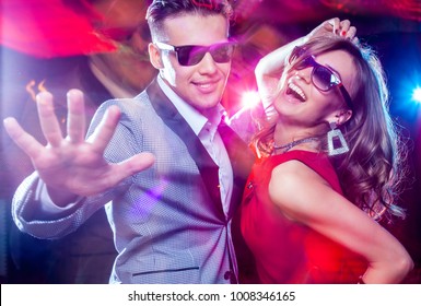 young couple having fun dancing at  party. - Powered by Shutterstock