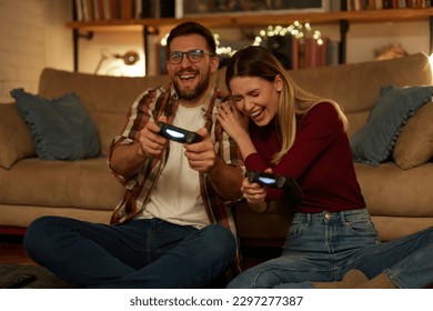 Best friends playing on playstation - Royalty free image #21436713