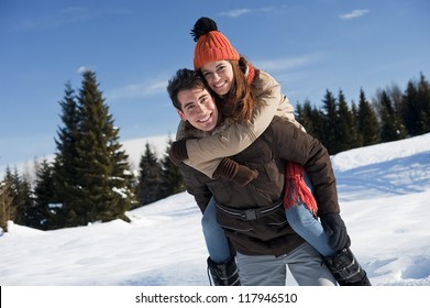 Young couple having fun on the snow