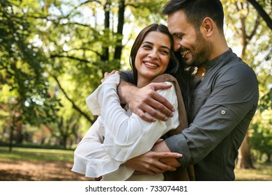 Young couple having fun in park.  - Shutterstock ID 733074481