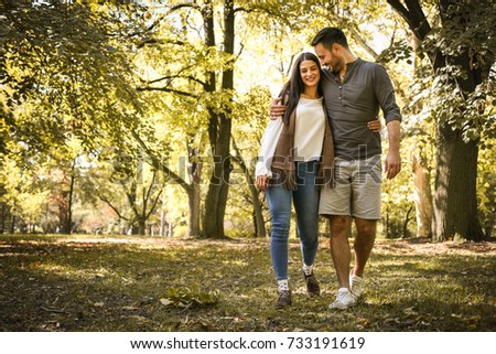 Young couple having fun in park. 