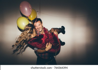 Young Couple Having Fun At The Party