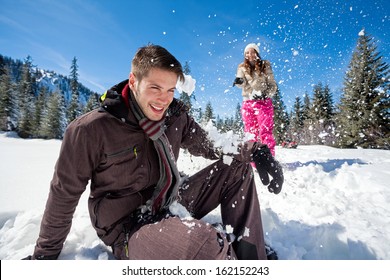 Young Couple Having Fun In Snow,  Outside