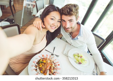 Young Couple Having Romantic Lunch In A Fancy Restaurant