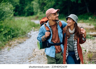 Young couple of hikers taking a walk in nature. Copy space. - Powered by Shutterstock