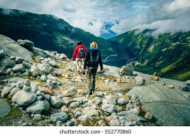 Young Couple Hiking In The Swiss Alps