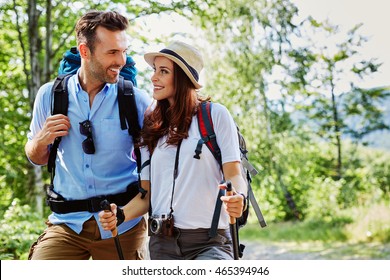 Young couple hiking together in mountains