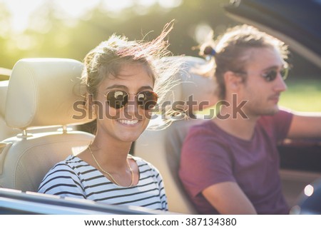 Similar – Two young women resting sitting inside of car