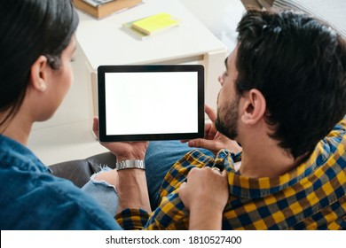 Young Couple Holding Tablet With Blank Screen For Copy Space