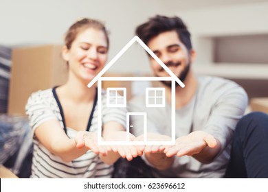 Young Couple Holding Their New, Dream Home In Hands
