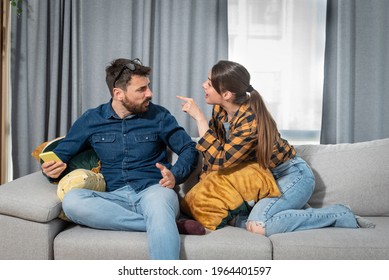 Young Couple At Home Have A Problem And Argue Due To Jealousy Caused By Chatting And Flirting Via Social Media Networks On Smart Phones, Relationship Difficulties Problems And Distrust