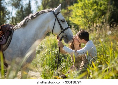 Young Couple With Horse