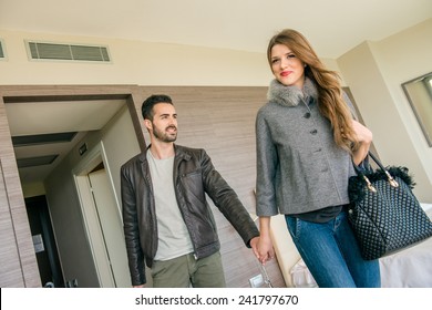 Young Couple At Hotel Room