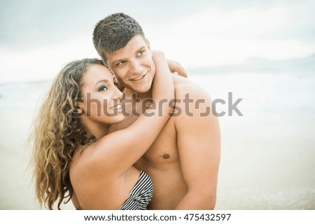 Young couple hugging, Ipanema Beach, Rio de Janeiro, Brazil