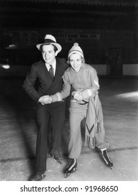 Young Couple Ice Skating Together