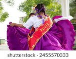 Young couple of kids marinera dancers peruvian traditional dance dancing in Huanchaco Trujillo Peru beach