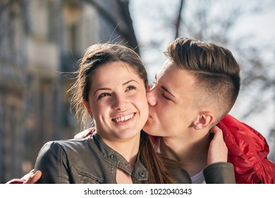 Young Woman Kissing Her Boyfriends Cheek Stock Photo 1286477386 ...