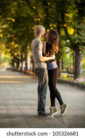 Young Couple Kissing On The Street