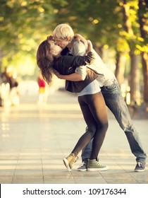 Young Couple Kissing On The Street