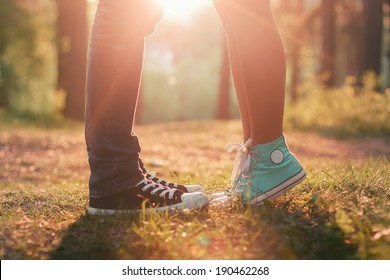 Young couple kissing in summer sun light. Kiss love standing - Powered by Shutterstock